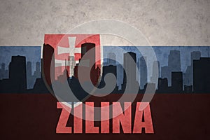 Abstract silhouette of the city with text Zilina at the vintage slovakia flag