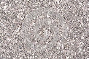 Abstract silver glitter background. Low contrast photo.