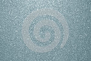 Abstract silver glitter texture background. Glittering silver grain or shining particles with sparkling light effect background fo