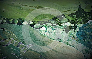 Abstract sludge texture. Green background. Water.