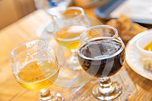 Abstract of Small Glasses of Micro Brew Beer Varieties On Bar