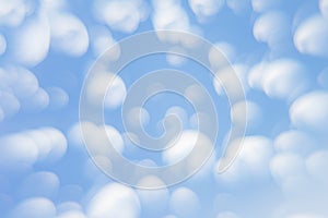 Abstract soft light blue background with blurred circles. Small clouds on a sunny day. Background.