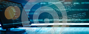 Abstract software development concept with code and laptop on blurred background representing programming, coding and