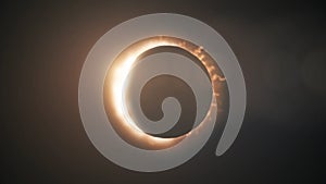 Abstract solar eclipse caused by a Lunar event with ring of fire on black background. Animated abstract view of a total