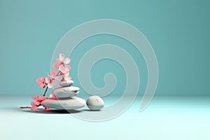 Stack of balanced zen stones, gray and white pebbles pyramid with pink cherry flowers