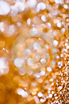 Abstract Spangles golden holidays lights on background