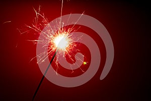 Abstract sparkler on red background