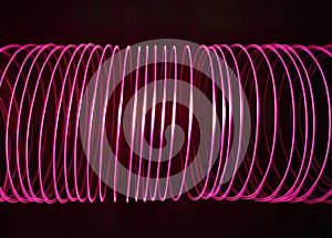 Abstract spiral light spring. Freeze-light neon pink tunnel.