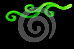 Abstract spiral whirl curvy blur blurry line in neon green color on black