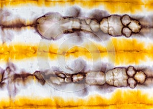 Abstract spotted yellow and brown pattern in batik photo