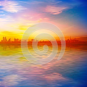 Abstract spring background gold sunset pink sky and silhouette of city