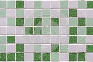 abstract square pixel mosaic wall background and texture. Green glass mosaic tile background pattern