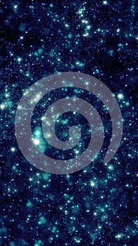 Abstract starry teal particles forming glowing galaxy background