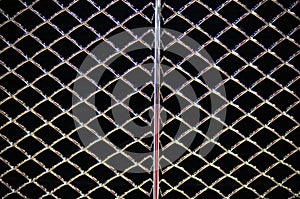 Abstract steel grid from car radiator, Black background
