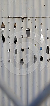 Abstract steel ruptured with holes