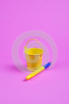 Abstract still life with a yellow bucket and a fountain pen