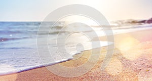 Abstract summer background of blurred beach and sea waves