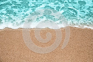 Abstract summer background, Soft wave-covered sand beach with blue water