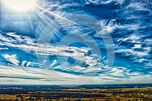 Abstract, sunburst, clouds, whisps, bluesky,  farm, rural, landscape, horizon