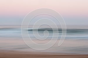 Abstract sunrise ocean background with blurred panning motion