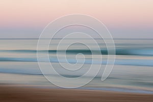 Abstract sunrise ocean background with blurred panning motion photo