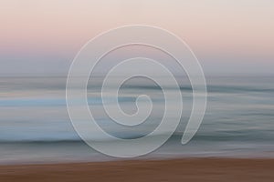 Abstract sunrise ocean background with blurred panning motion photo