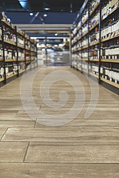 Abstract supermarket aisle interior blurred defocused background with bokeh light