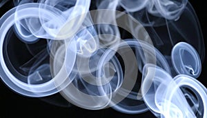 Abstract Swirling Blue Smoke Pattern on Black Background
