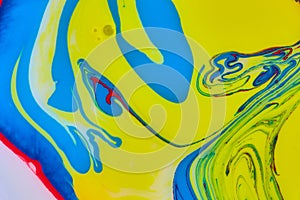 Abstract swirling blue, yellow and red background asset with oil bubble