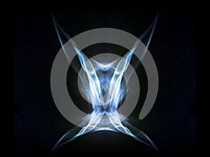 Abstract symetrical shaped smoke against black background