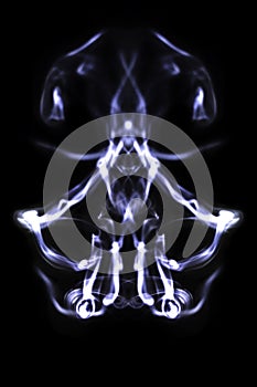 Abstract symetrical shaped smoke against black background