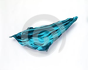 Abstract teal fabric in motion