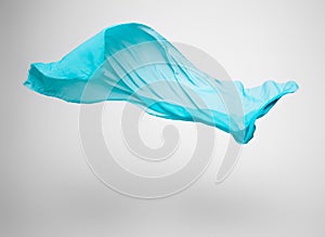 Abstract teal fabric in motion