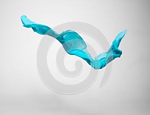 Abstract teal fabric in motion