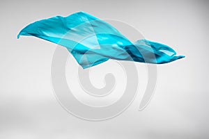 Abstract teal fabric in motion