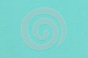 Abstract teal painted textured wall background.