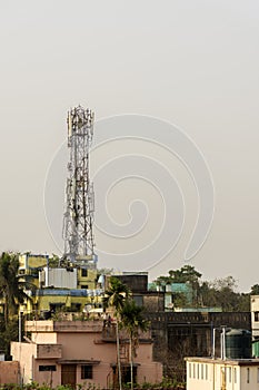 Abstract telecommunication tower Antenna and satellite dish at sunset sky background