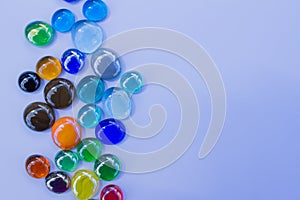 Abstract texture background of bright colorful glass beads on plain background