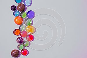 Abstract texture background of bright colorful glass beads on plain background