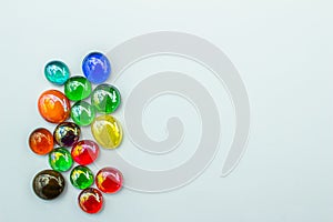 Abstract texture background of bright colorful glass beads on plain background