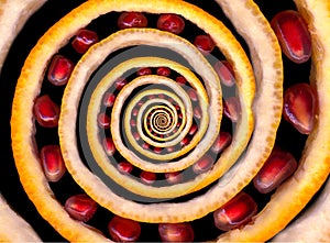 Abstract texture fractal spiral made of fruits: orange and lemon citron, pomegranate seeds. Fruit spin. Abstract food fruit fracta photo