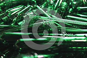 An abstract texture of green pet plastic preforms
