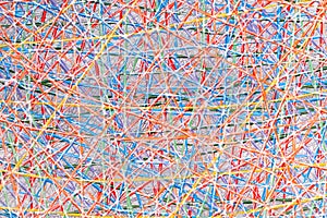 Abstract texture of interwoven colorful threads