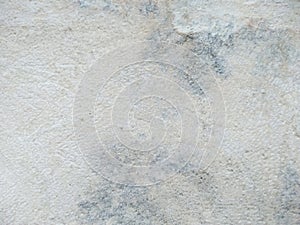 Abstract texture of mossy, porous, cracked and weathered sandstone walls