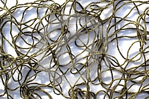 Abstract texture from tangled bright threads.