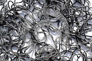 Abstract texture from tangled bright threads.