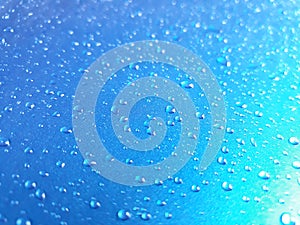 Abstract, texture, water droplets on car glass, image for blue background, rainy season concept, selectable focus.