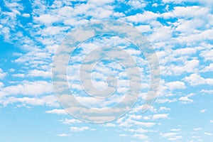 Abstract texture of white clouds on blue sky out of focus for use as background