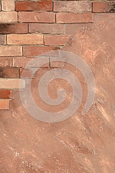 Abstract textured background with half of space with brick wall