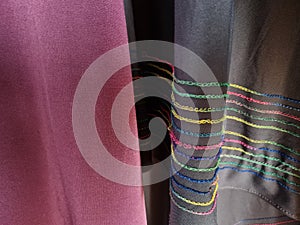 Abstract textured hijab cloth background in gray and red with a combination of colored stripes